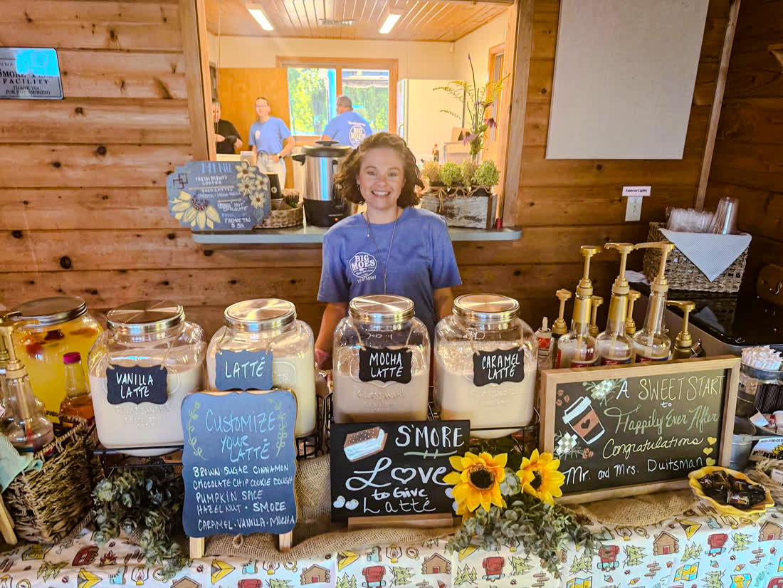 Big Moe's team member serving customized lattes at the coffee bar